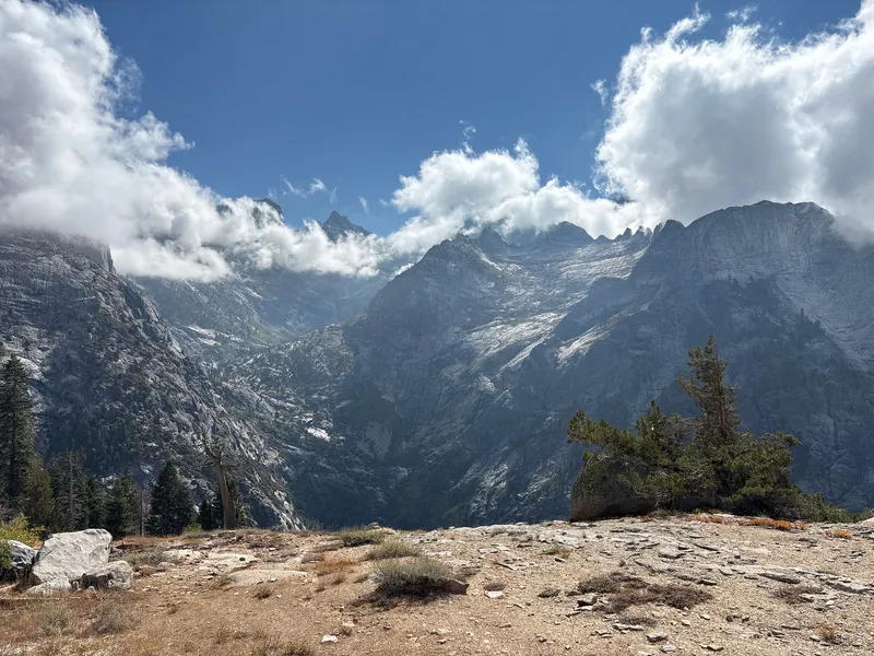 Another ridge view, with the peaks breaking through the clouds